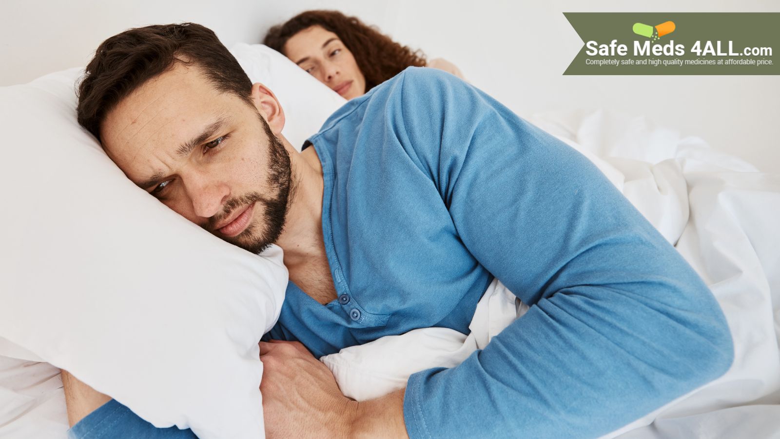 Couple lying on the bed in distress